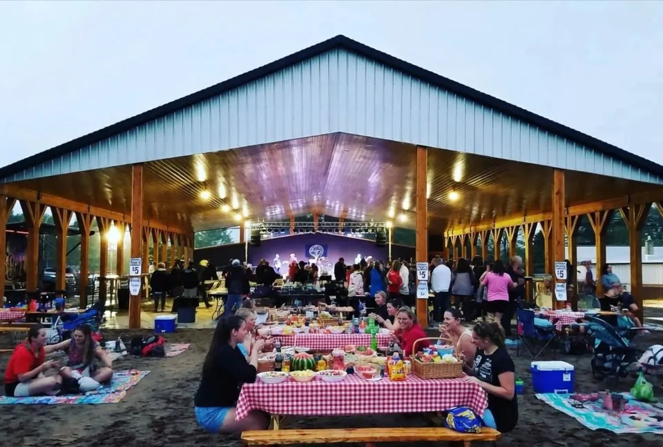 Guests gathered at tables under the Lakeside Pavilion