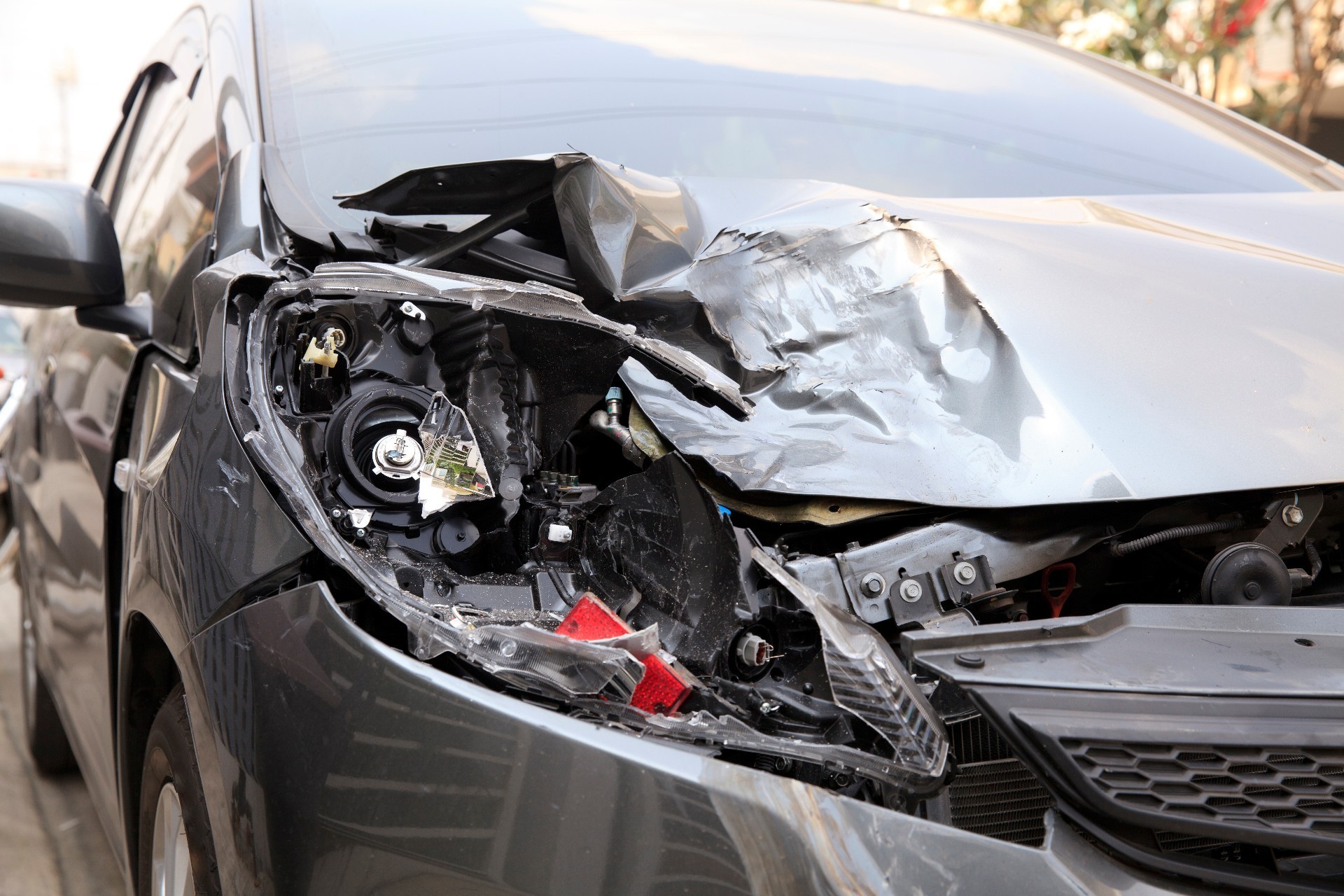 A damaged car after a collision, showing the repair need
