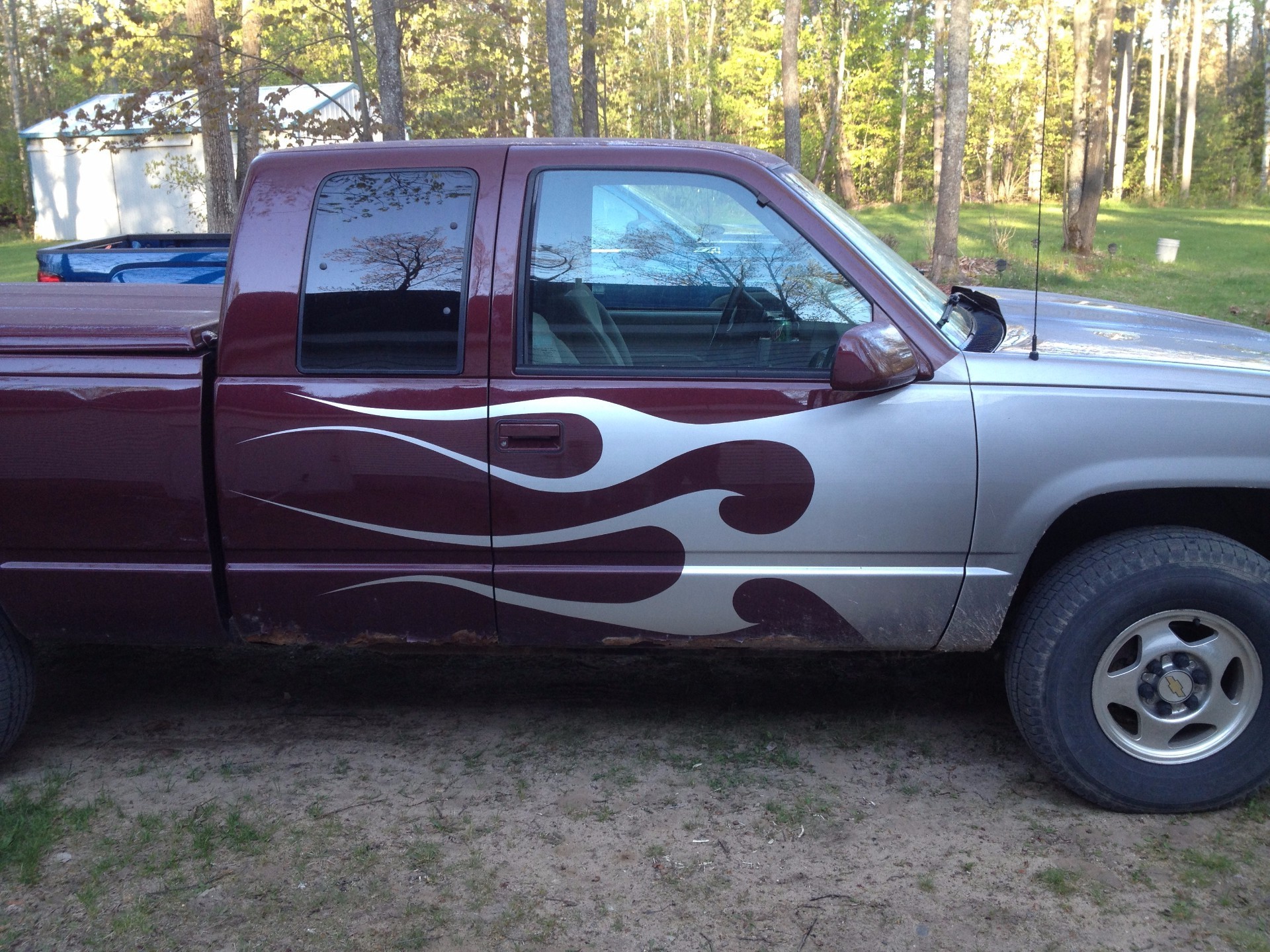 Freshly painted car panel in a spray booth or paint bay